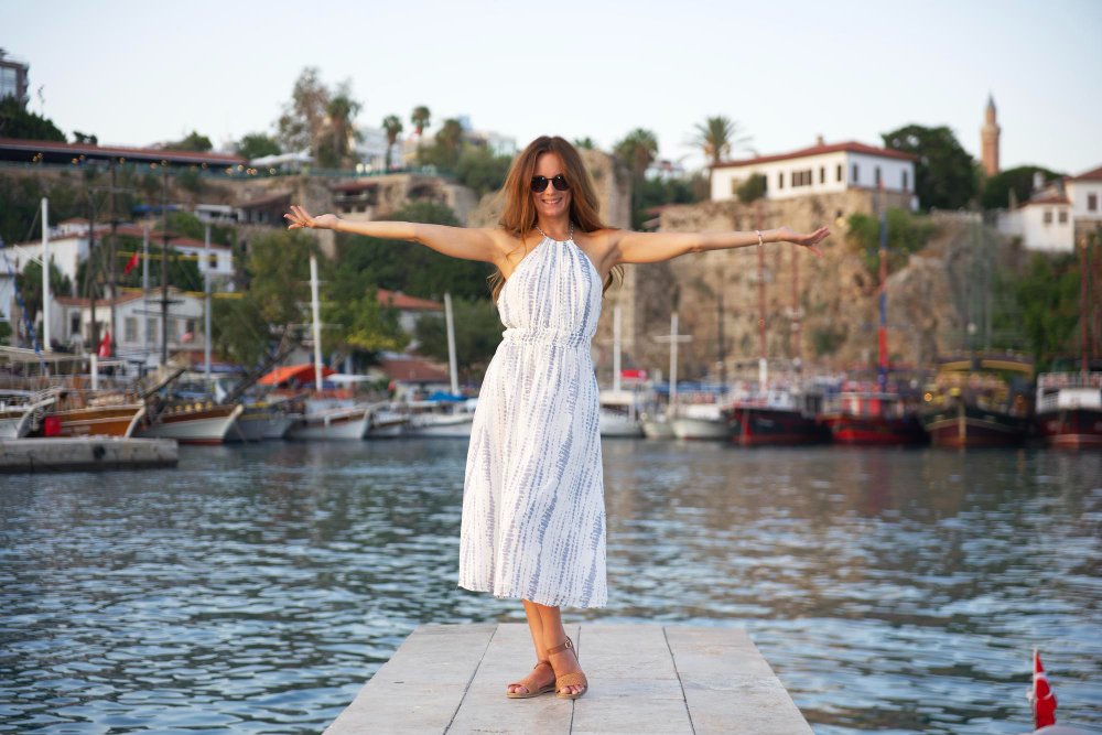 Visitor at Antalya harbor near Kaleici, a popular stop for UK dental tourism patients in Turkey