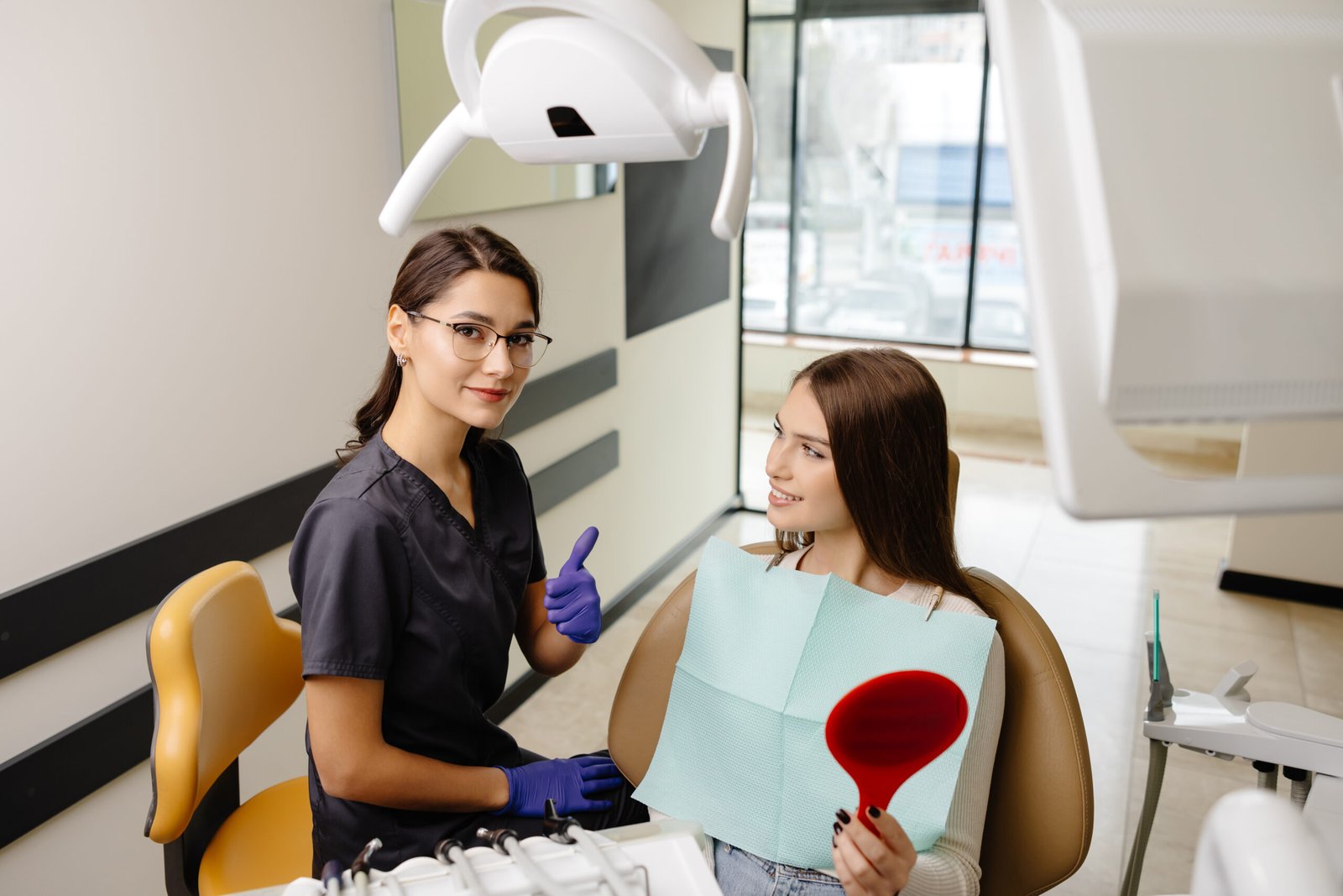 Patient reviewing zirconia crowns and bridge results after aesthetic restorative dentistry at Best Smile Turkey